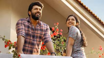 Poster of Bethlehem Kudumba Unit showing leads Nivin Pauly and Mamitha Baiju against a festive backdrop.