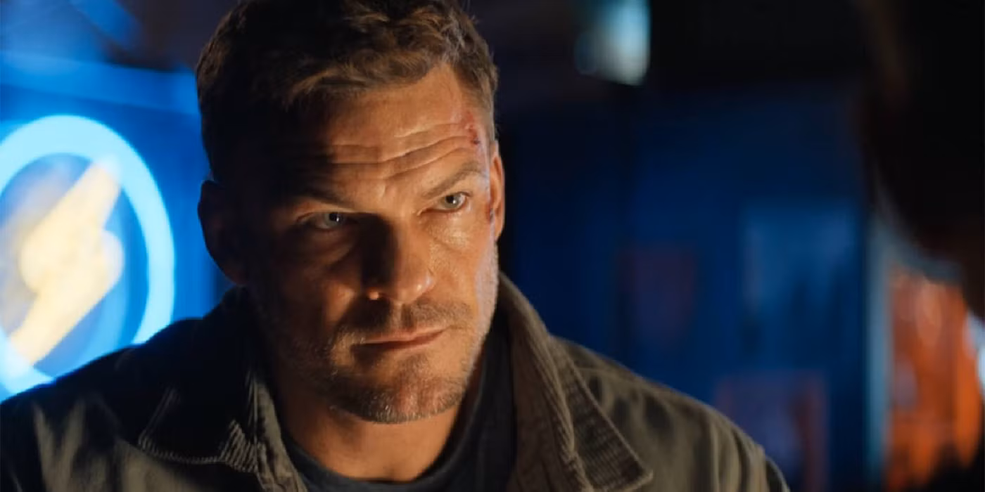 Alan Ritchson as Jack Reacher standing against a gritty urban backdrop, promotional still for the series.