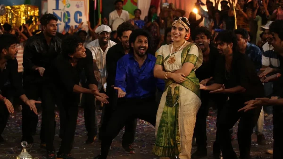 Hip Hop Tamizha Aadhi performing on stage in a still from Meesaya Murukku 2, surrounded by the film's cast during a musical sequence