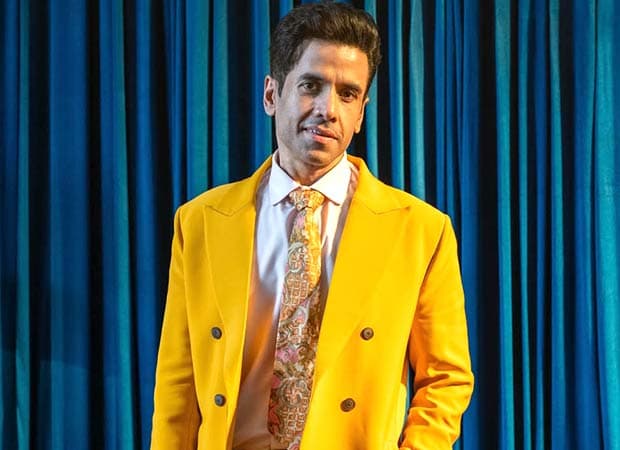 Actor Tusshar Kapoor smiling during a media interaction