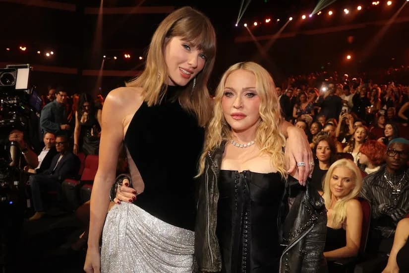 Madonna holding a Moon Person trophy on stage at the 2026 MTV Video Music Awards