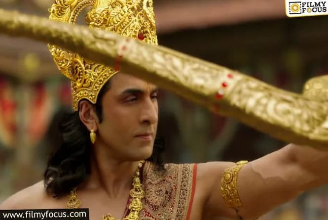 Ranbir Kapoor in Lord Rama costume, arms crossed, captured in behind‑the‑scenes footage released on his birthday.