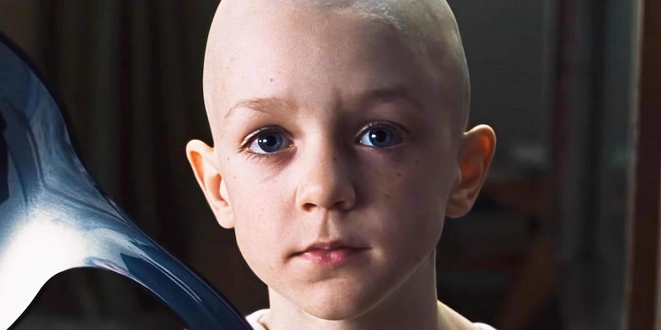 Neo in sunglasses standing before a cityscape inside the Matrix simulation, moments before flying off in the film's final scene.
