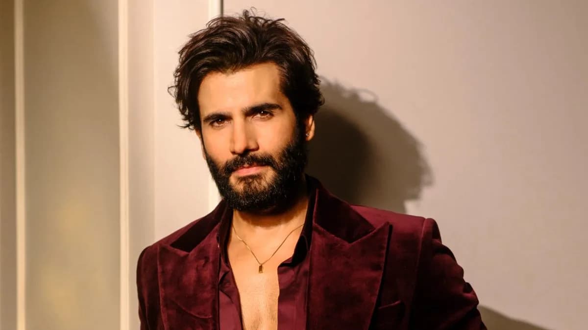 Karan Tacker in Bhay promotional still, wearing a dark coat and holding a flashlight