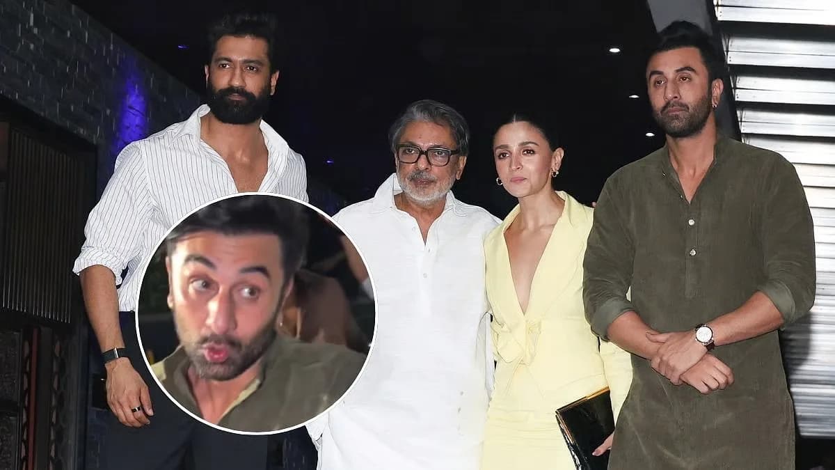Ranbir Kapoor in olive‑green kurta turning towards a photographer while Alia Bhatt and Vicky Kaushal stand nearby outside a Mumbai restaurant