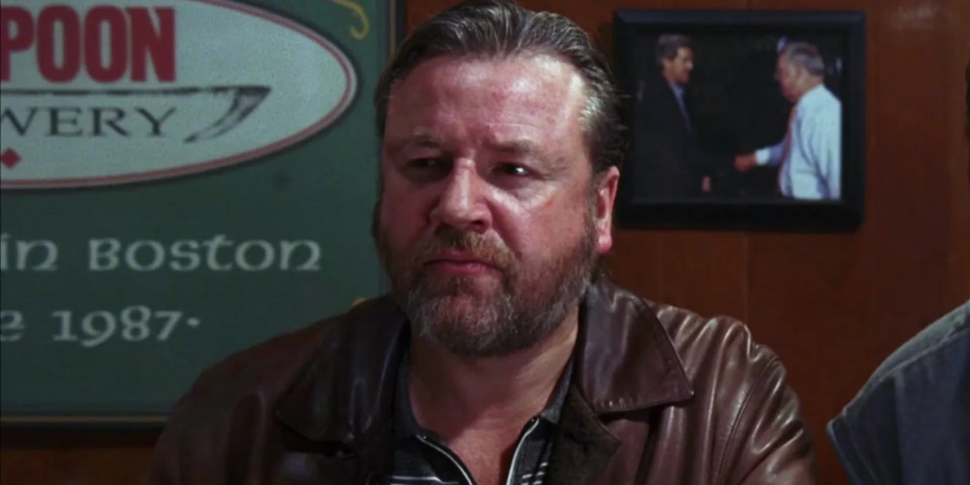 Still from The Departed featuring Leonardo DiCaprio and Matt Damon in a tense confrontation scene