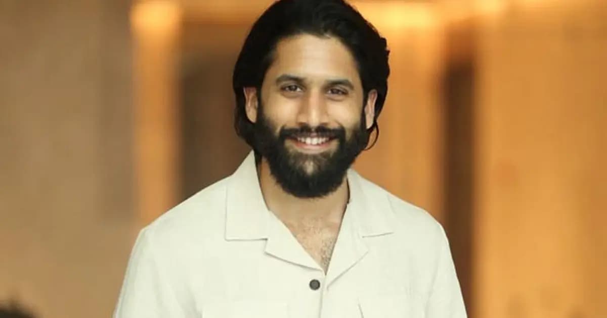 Conceptual poster showing Naga Chaitanya and Satvika Veeravalli standing side by side against a city skyline backdrop