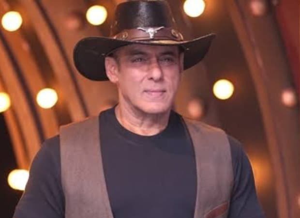 Salman Khan hosting Weekend Ka Vaar on the Bigg Boss 20 set, speaking into a microphone.