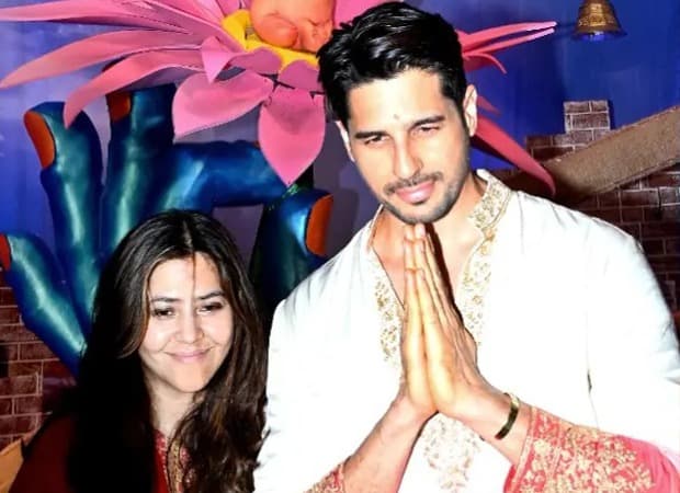 Sidharth Malhotra and Ektaa R Kapoor standing barefoot with folded hands at the Lalbaugcha Raja pandal during Ganesh Chaturthi.