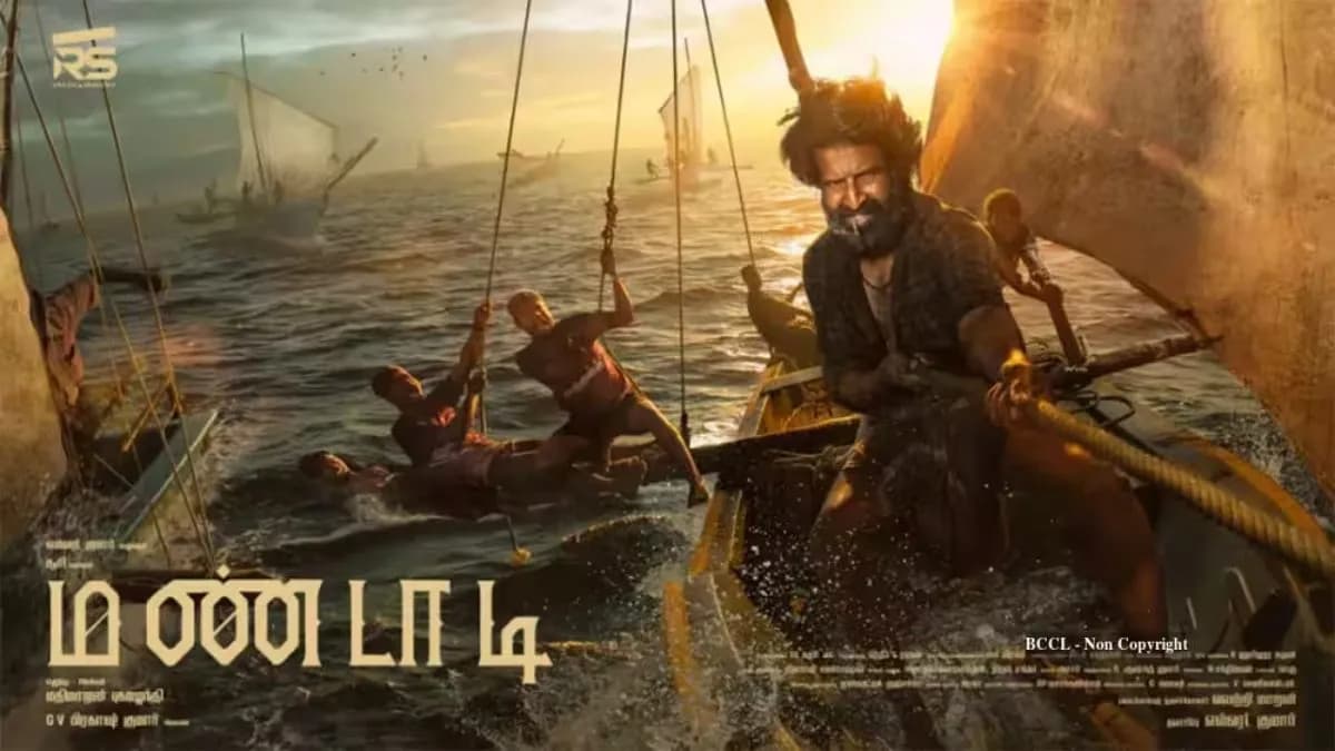 Soori in a still from the Tamil film Mandaadi, set against a boat race backdrop