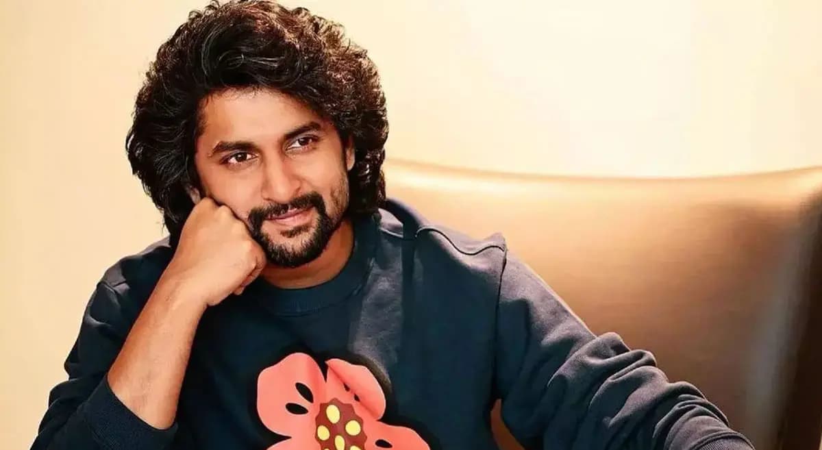 Nani in a rugged, intense look, standing against a dark background with a determined expression.