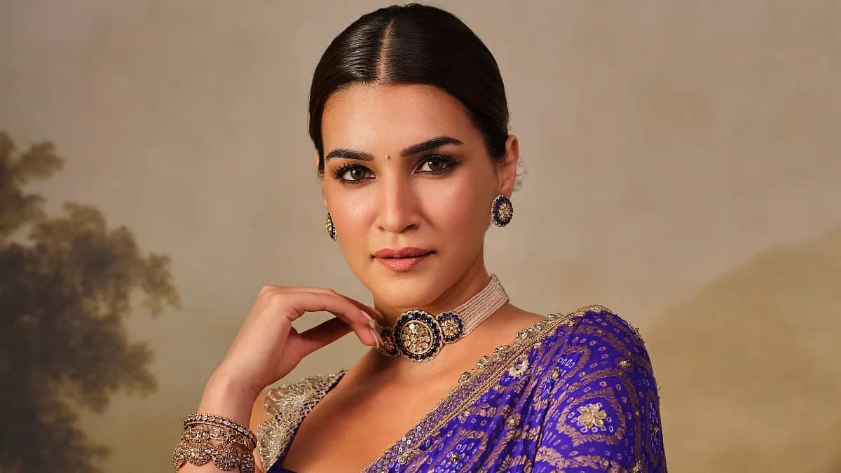 Kriti Sanon in a dramatic pose, looking intense under dim lighting