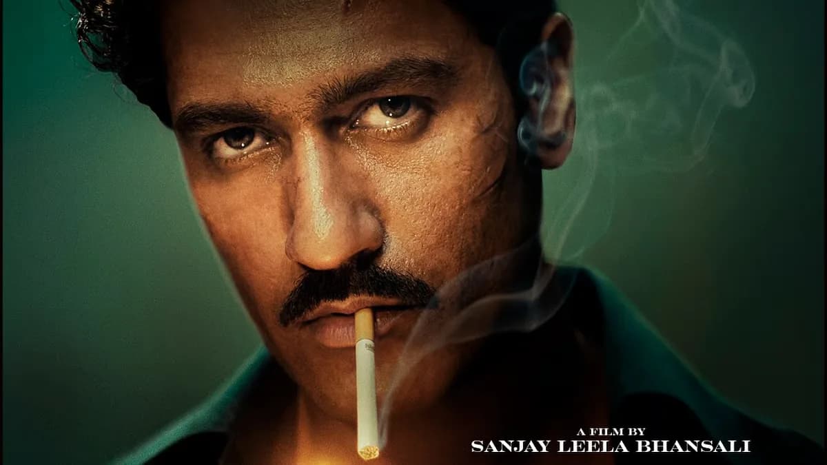 Vicky Kaushal in a retro-styled poster for Love And War, smoking a cigarette and holding a silver lighter, with curly hair and a moustache.