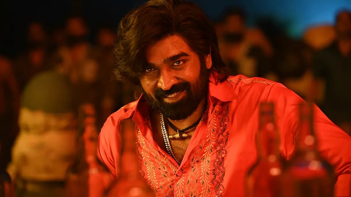 A still from the film Baththa showing Vijay Sethupathi in a school restroom, looking pensive.