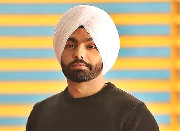 Punjabi singer and actor Ammy Virk performing on stage at a concert