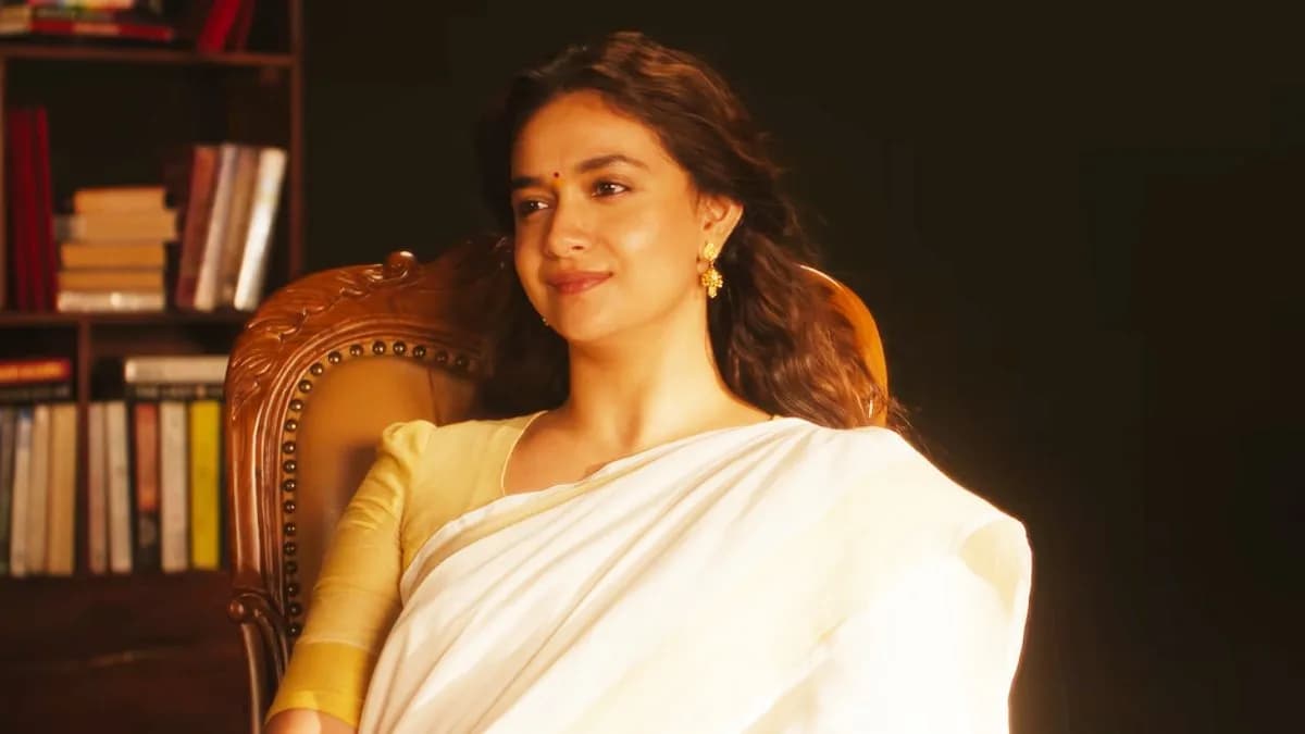 Keerthy Suresh in a dramatic scene from Dorothy, standing in a rural Tamil Nadu setting