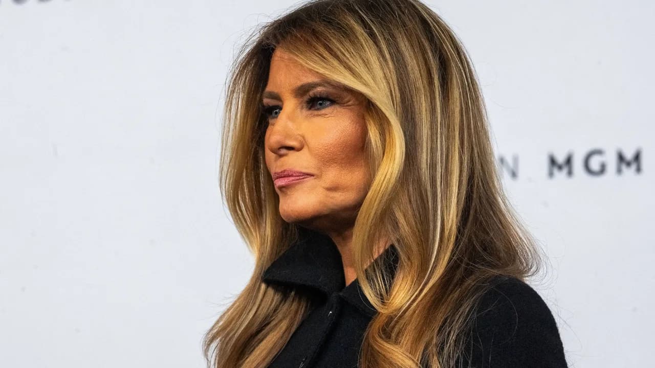 A split-screen image: one side shows Tom Cruise in a construction helmet; the other shows Melania Trump in a white dress, looking straight ahead.