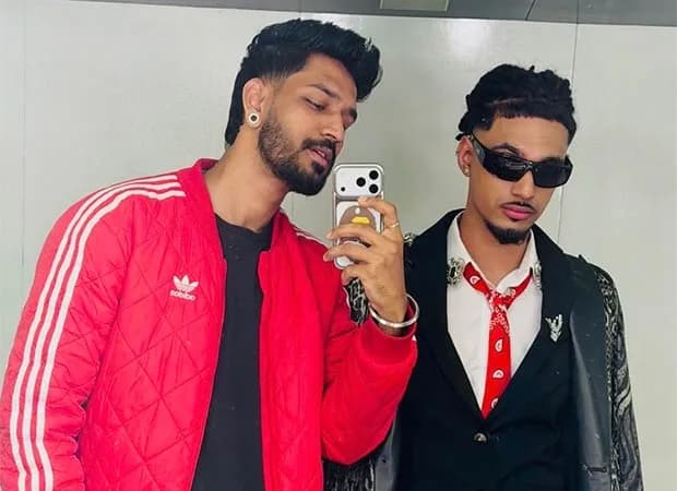 Yung DSA speaking passionately inside the Bigg Boss house with other contestants watching.