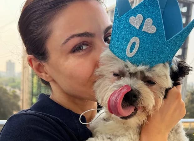 Soha Ali Khan sitting with her dog Oreo, looking thoughtful
