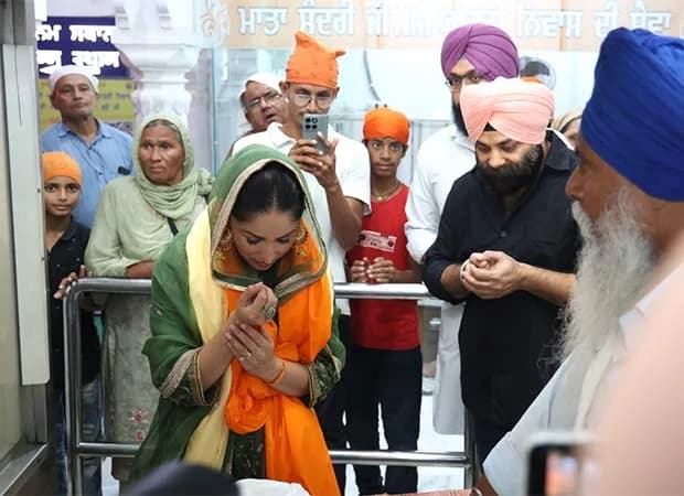 Yami Gautam Dhar at Patna Sahib Gurudwara, wearing a traditional outfit, hands folded in prayer.