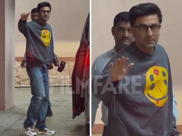 Ranbir Kapoor, clean-shaven and wearing a T-shirt and jeans, waves to photographers outside Sanjay Leela Bhansali's office.