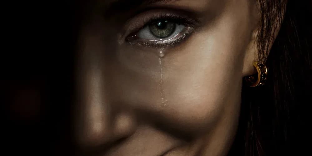 Jessica Chastain in a tense scene from the horror film Other Mommy, staring into the camera with a haunting expression.