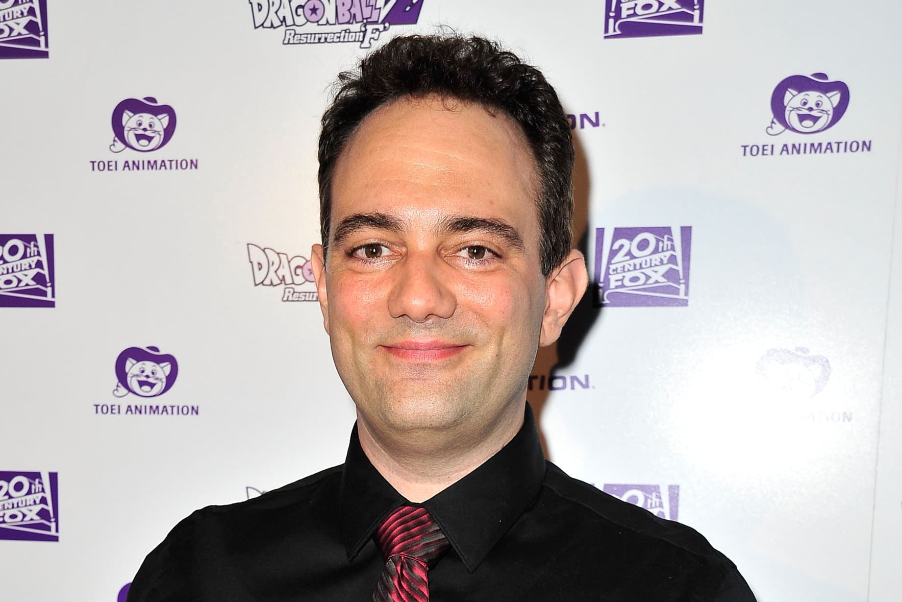 Voice actor Mike McFarland smiling at a convention appearance