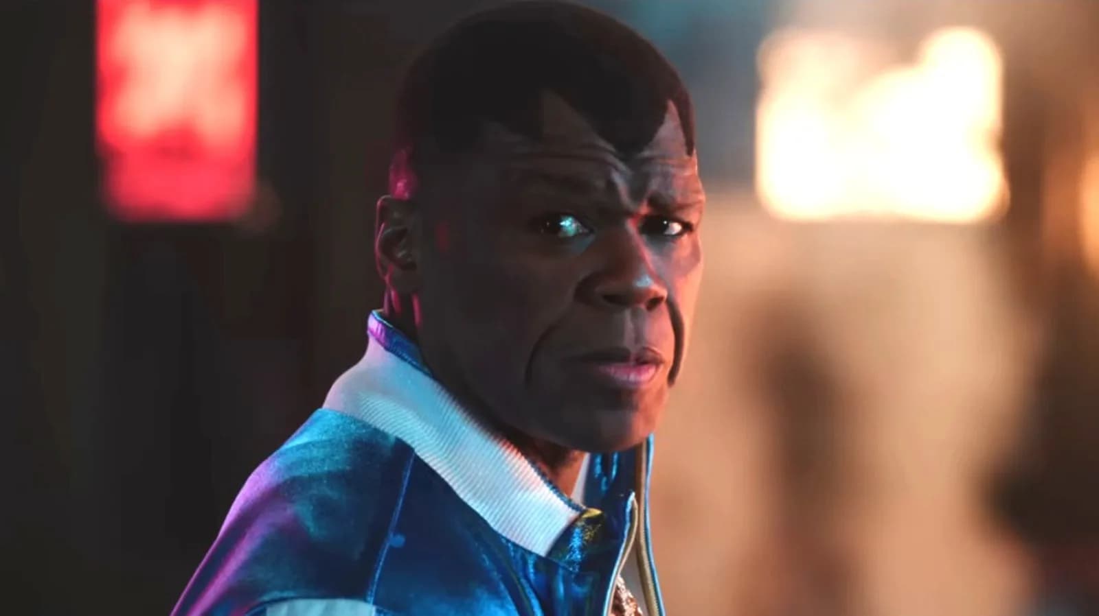 Promotional image for the 2026 Street Fighter movie showing the ensemble cast of fighters in costume