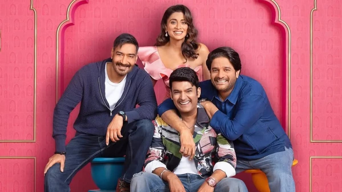 Ajay Devgn and the Drishyam 3 cast seated on the set of The Great Indian Kapil Show alongside Kapil Sharma and Archana Puran Singh.