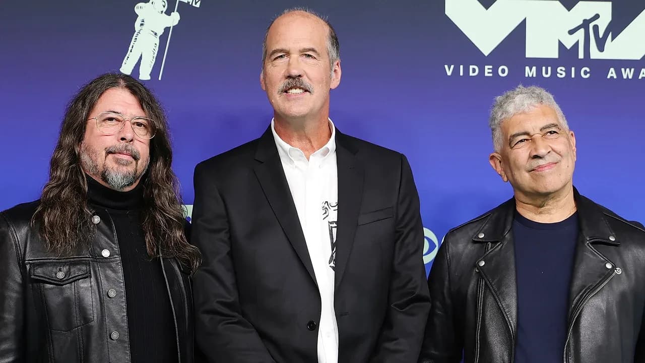 Dave Grohl, Krist Novoselic and Pat Smear posing together on the red carpet at the 2026 MTV VMAs in Los Angeles