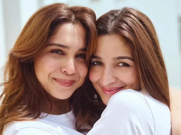 Alia Bhatt smiling on set of 'Don't Be Shy' with vibrant backdrop