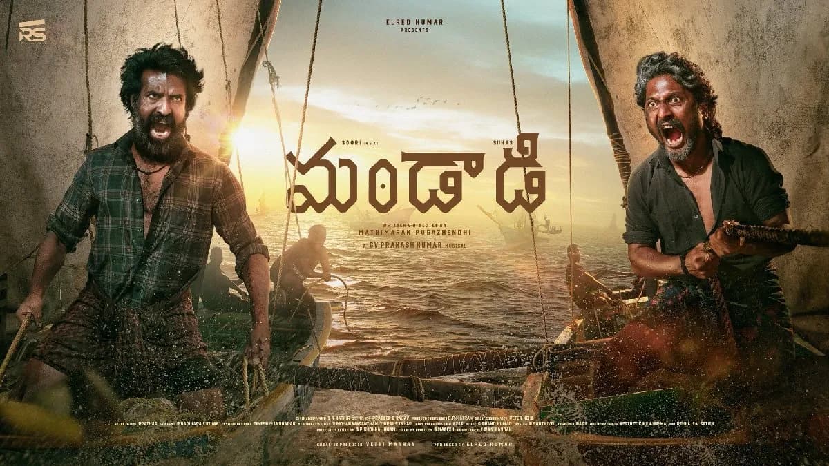 Poster or still from the Telugu-Tamil film Mandaadi featuring Soori and Suhas against a sea and boat racing backdrop