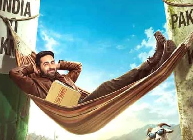 Ayushmann Khurrana in a dramatic pose, standing in front of a red banner that reads 'Udta Teer' in bold letters.