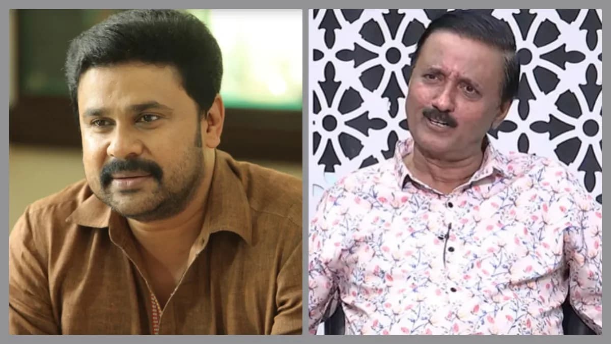 Actor Dileep speaking with lawyer B. Raman Pillai in a courtroom setting