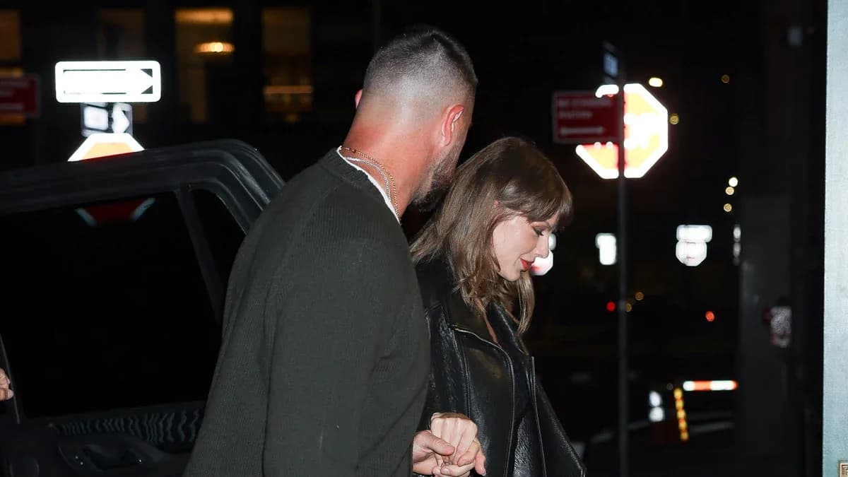 Taylor Swift and Travis Kelce walking into Torrisi restaurant in New York City.