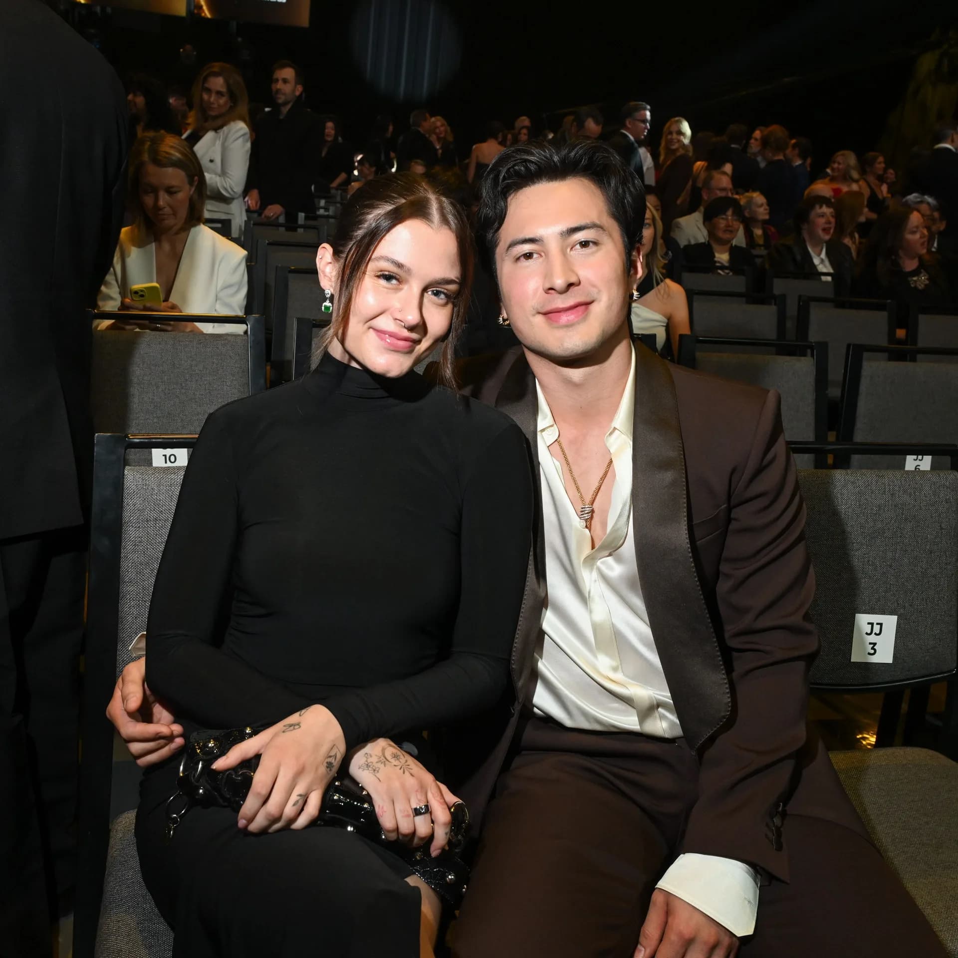 Hudson Williams and Katelyn Larson posing together on a red carpet