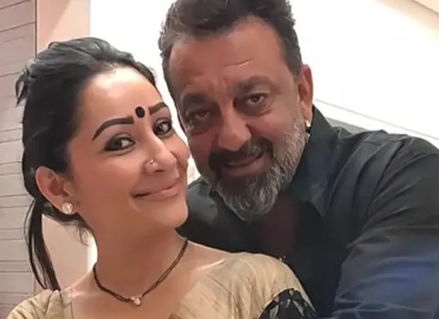 Sanjay Dutt in a black turtleneck, looking at the camera with a soft expression.