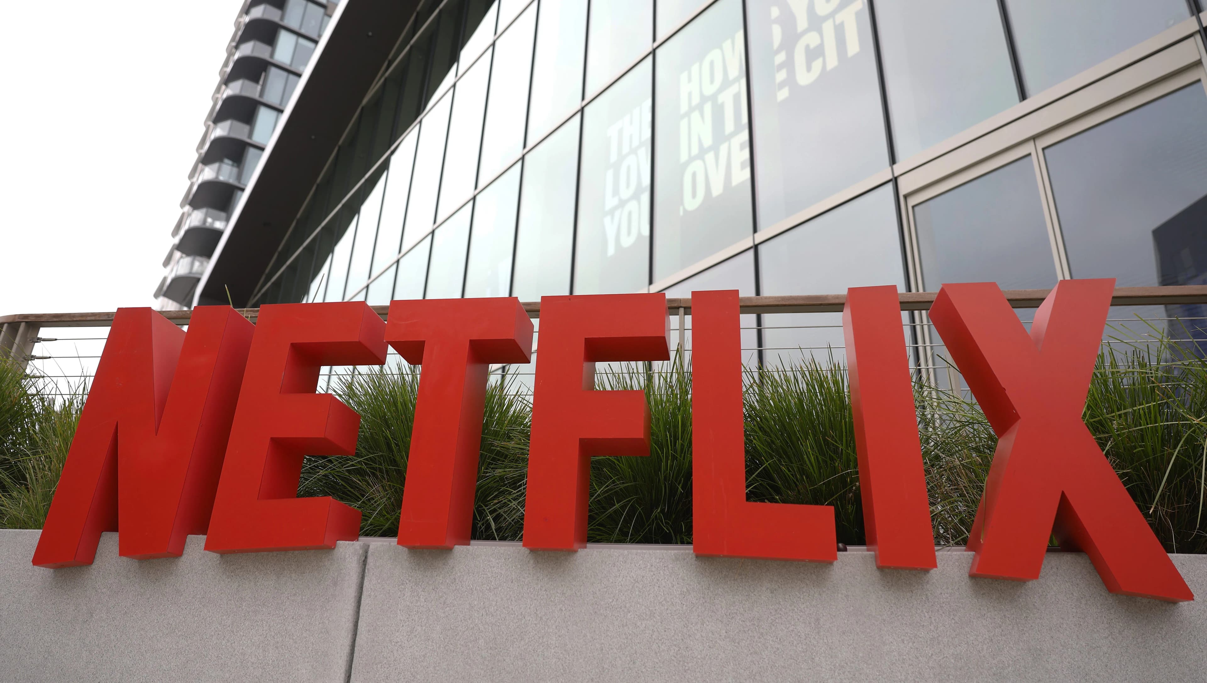 Netflix logo displayed on a smartphone screen against a red background