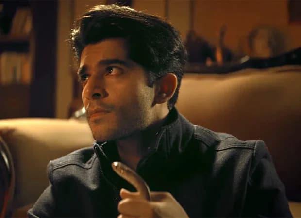 Promotional trailer still from Junglywood showing lead actor Shaan R Grover at a tense party scene depicting Bollywood's insider-outsider divide.