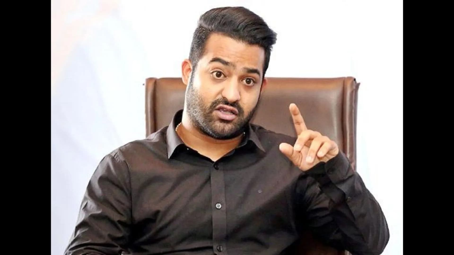 NTR standing in front of a digital screen showing a deepfake video of Janhvi Kapoor