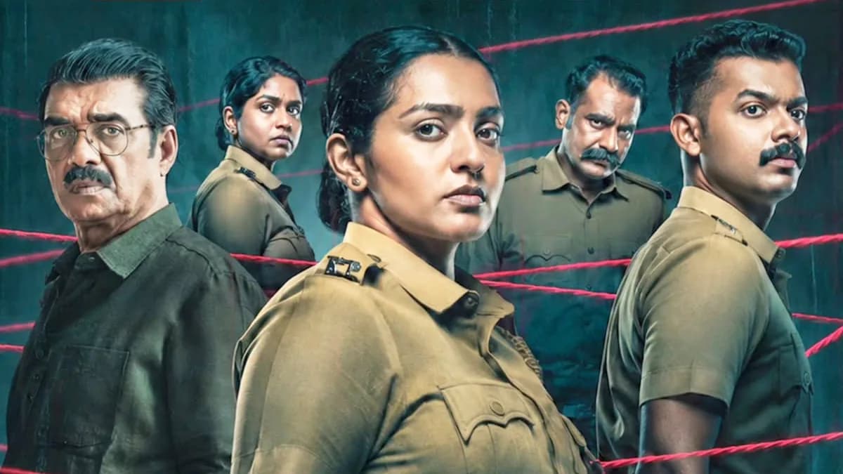 Parvathy Thiruvothu in a police uniform in a still from Pradhama Drishtya Kuttakkar