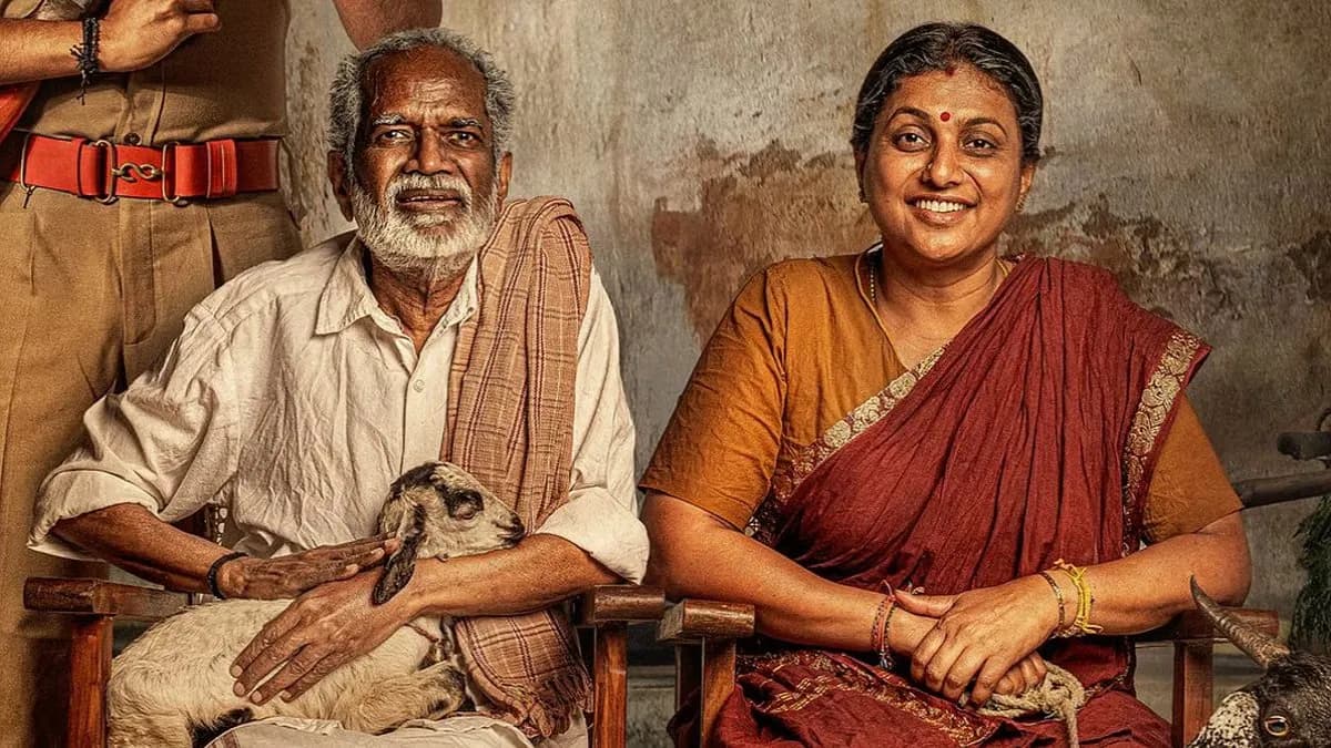 Gangai Amaran and Roja seated together at a press meet promoting their film Lenin Pandian.