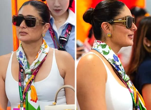 Kareena Kapoor Khan at the Singapore Grand Prix, wearing a white tank top and a colourful scarf, sunglasses on, smiling.