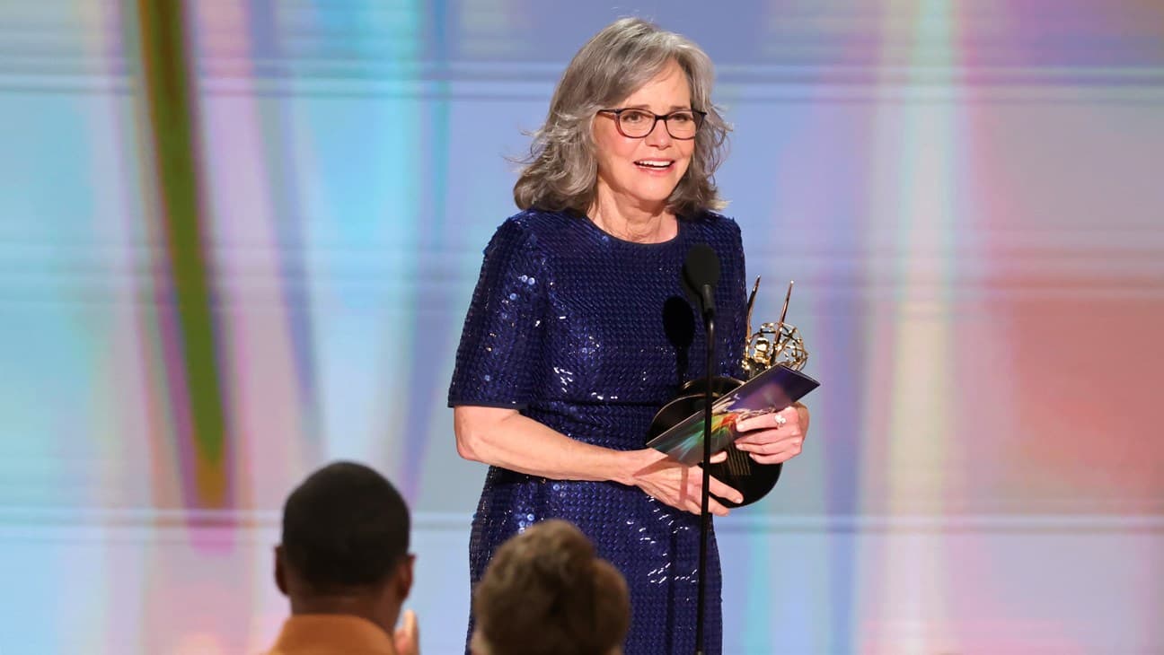 Sally Field holding her Emmy trophy on stage at the 2026 Emmy Awards