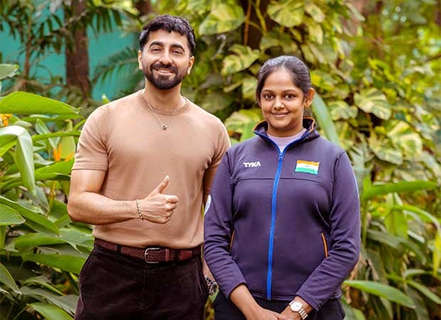 Ayushmann Khurrana presenting a new rifle to Indian shooter Meghana Sajjanar during their meeting