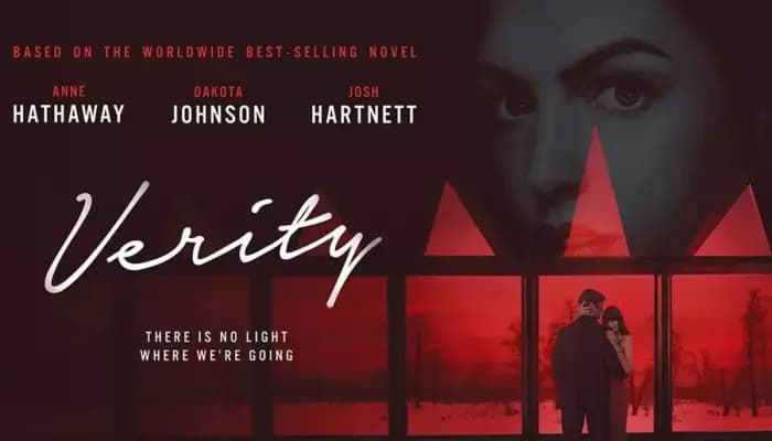 Anne Hathaway in a dark, moody scene from Verity, eyes sharp, face half-lit.