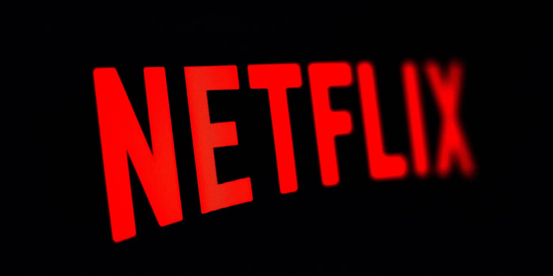 A massive troll emerging from a snowy mountain, silhouetted against a stormy sky. The Netflix logo glows faintly in the background.