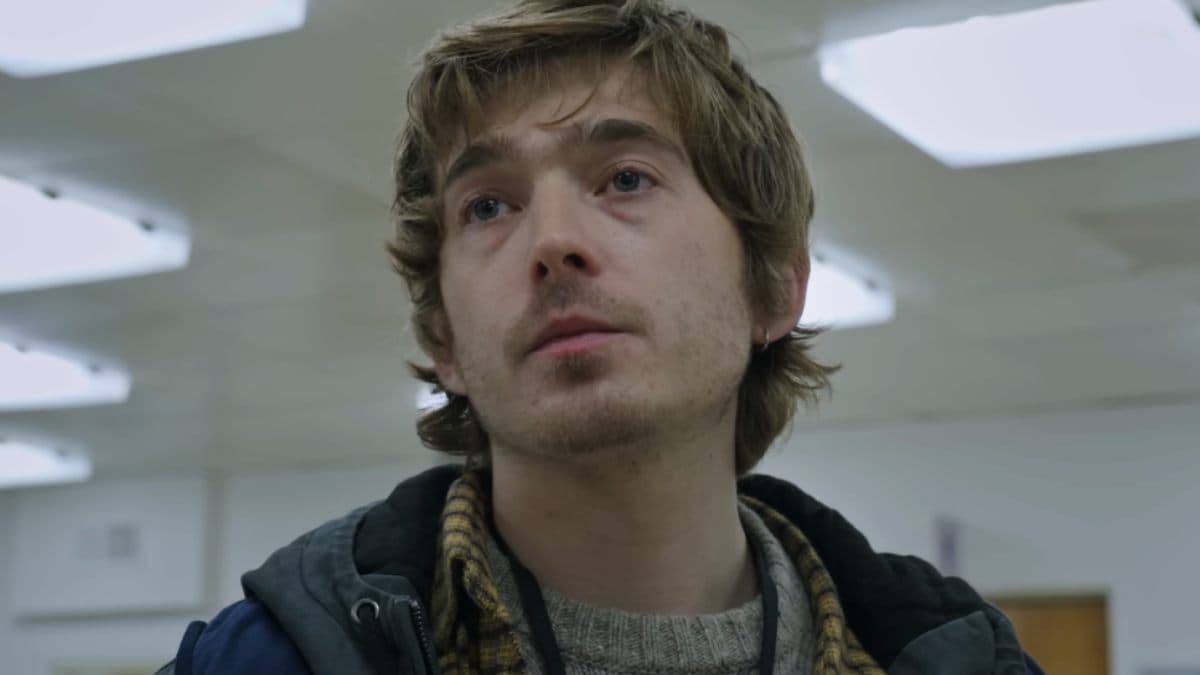 Poster of Resident Evil (2026) showing Austin Abrams as Bryan amid a dark, monster‑infested hospital corridor