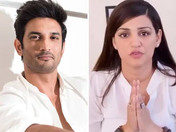 Shweta Singh Kirti speaking into a camera, with a photo of Sushant Singh Rajput in the background