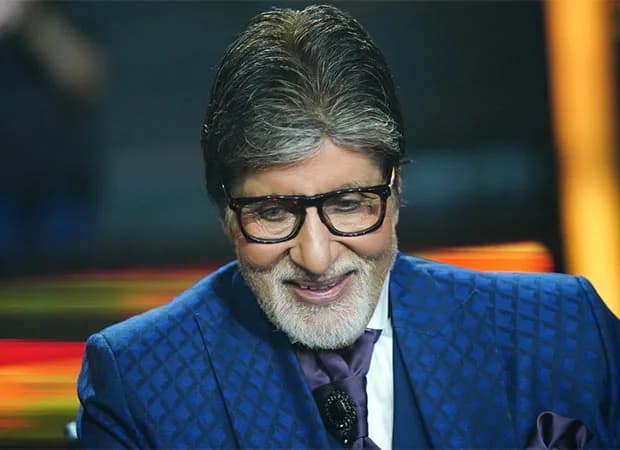 Amitabh Bachchan sitting at the Kaun Banega Crorepati desk, looking focused and tired.